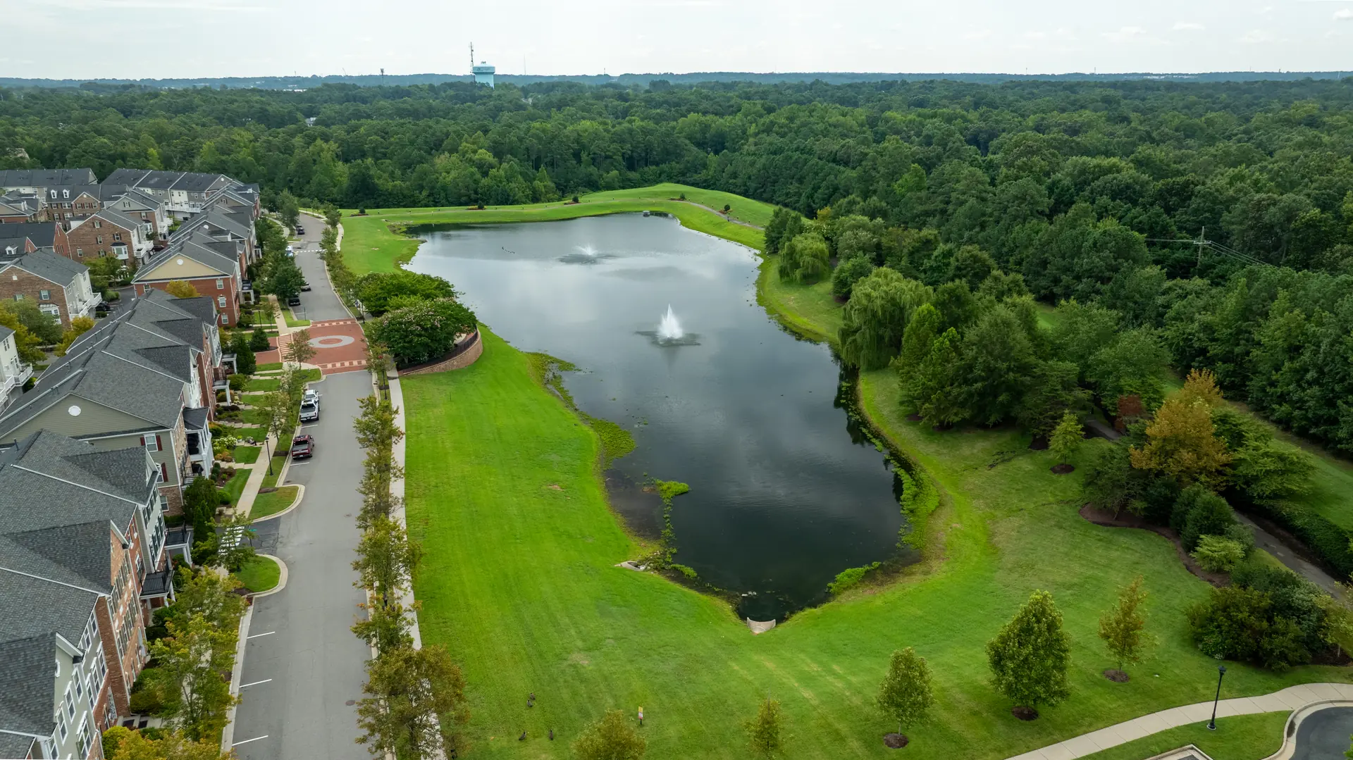 Aerial view of the fountain pond and walking path the home overlooks