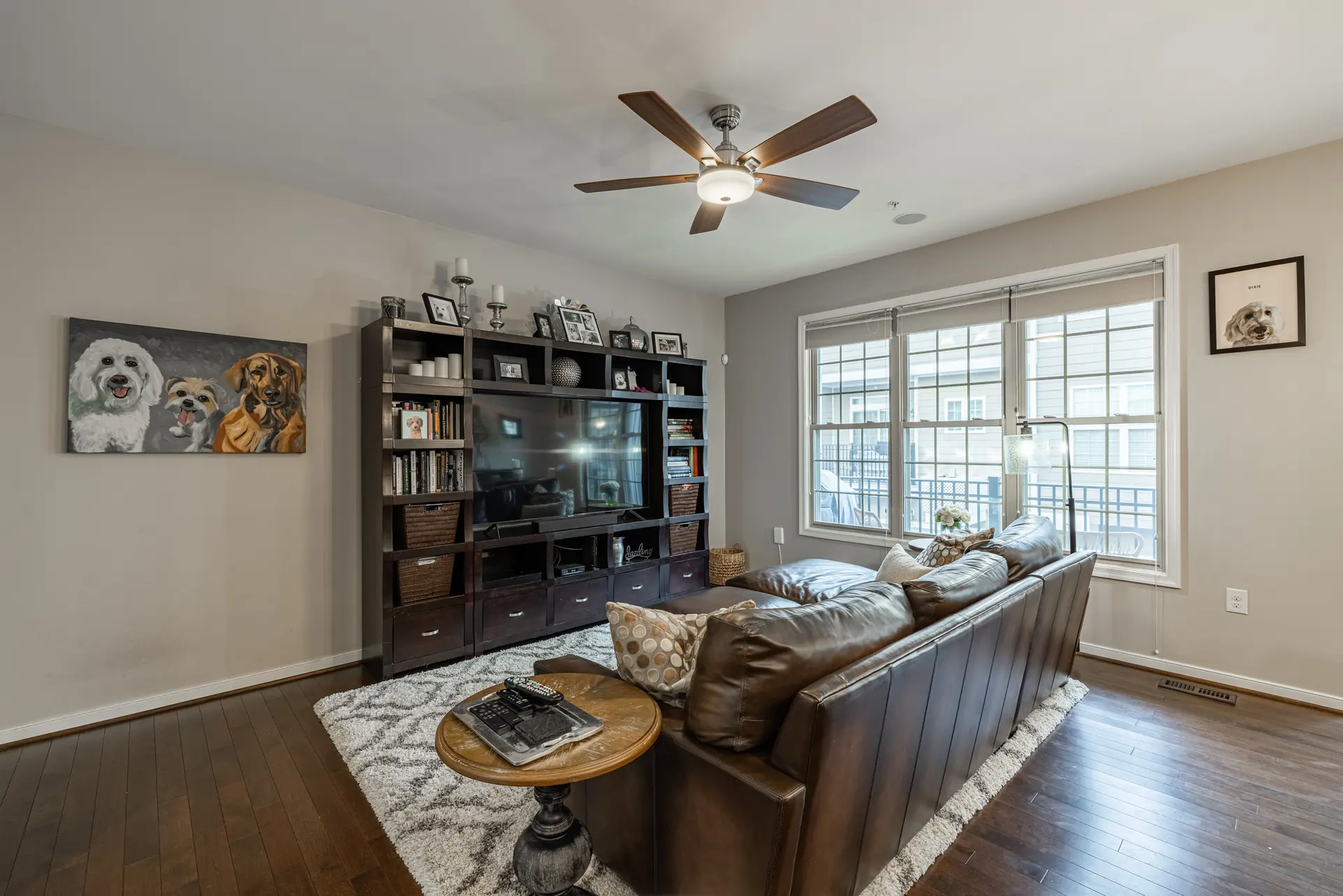 Family room with built-in entertainment center and hardwood floors
