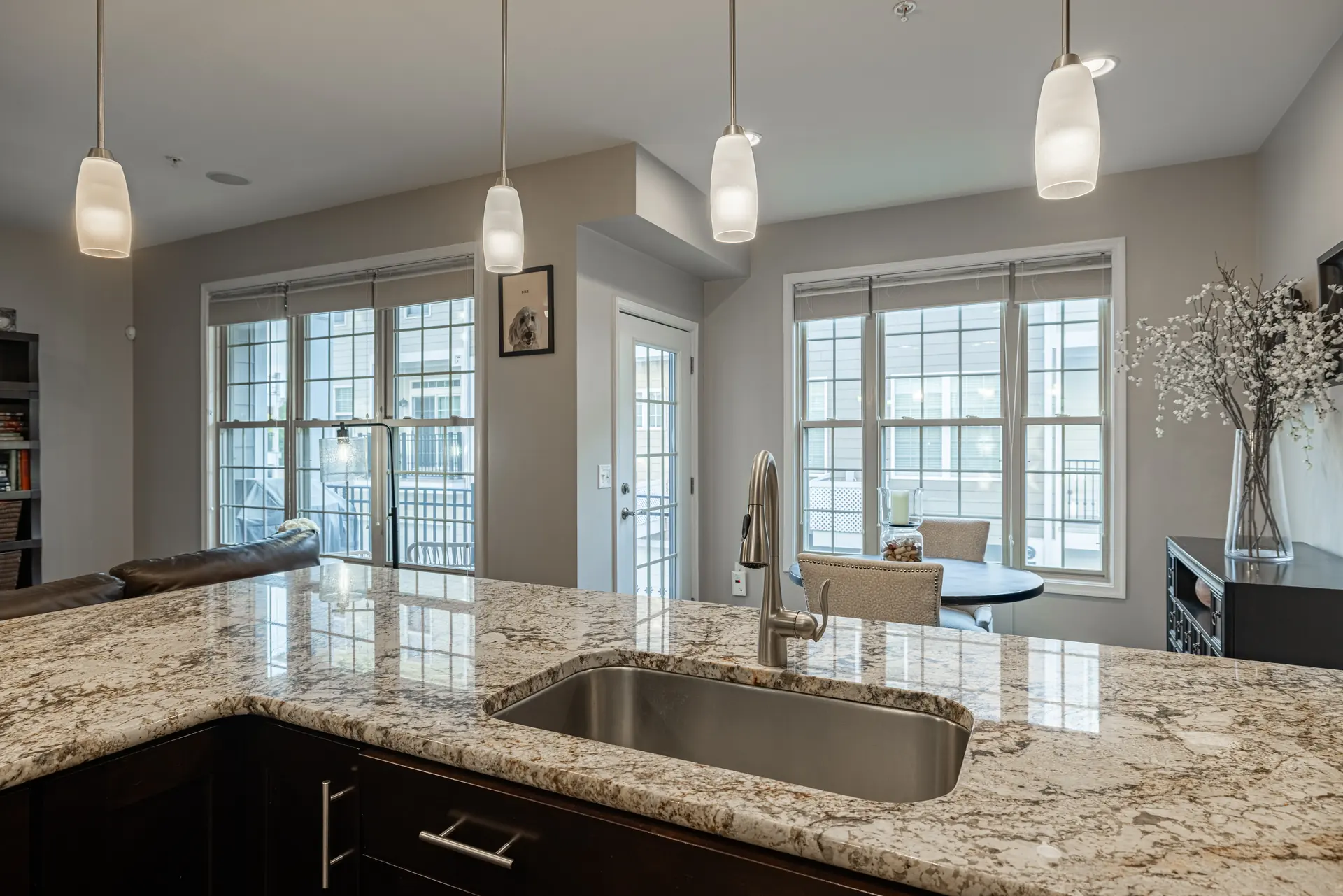 Island sink facing the kitchen windows