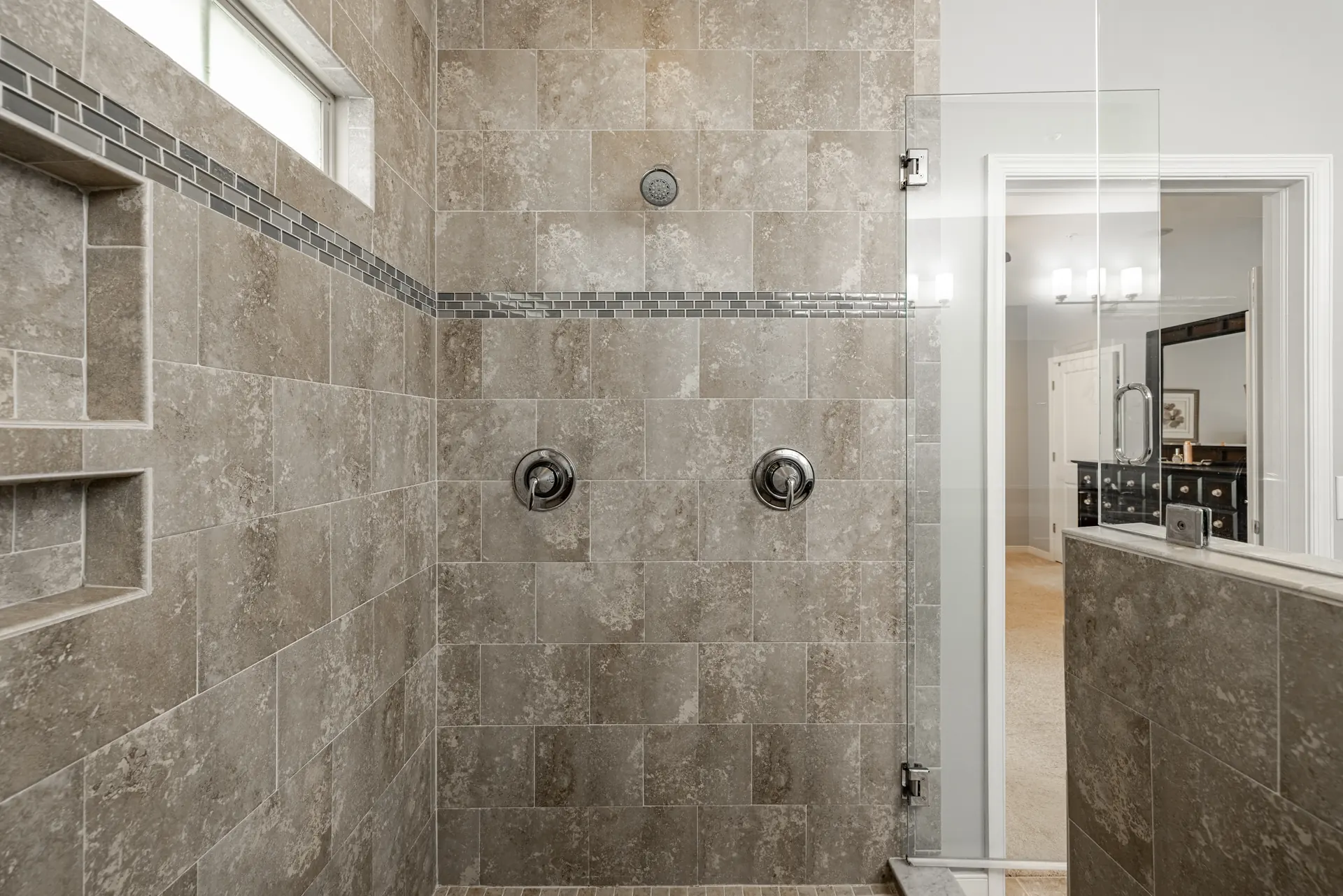 Walk-in tile shower with built-in niches