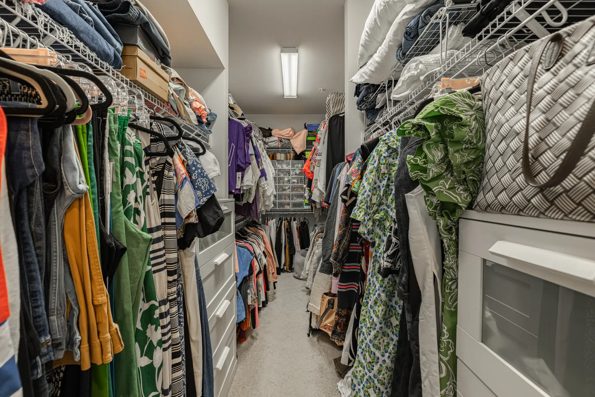 Walk-in closet with floor-to-ceiling shelving
