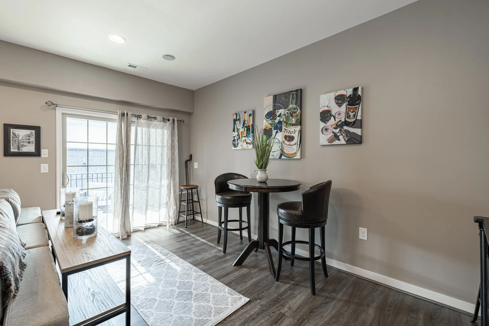 Bistro table beside the sliding doors in the upper-level living room