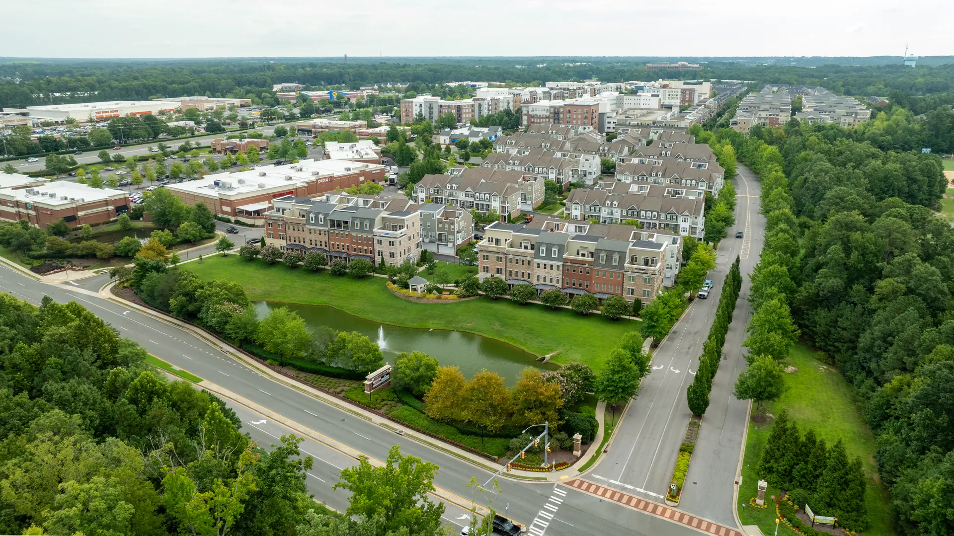 Aerial view of the pond, fountain and surrounding townhomes