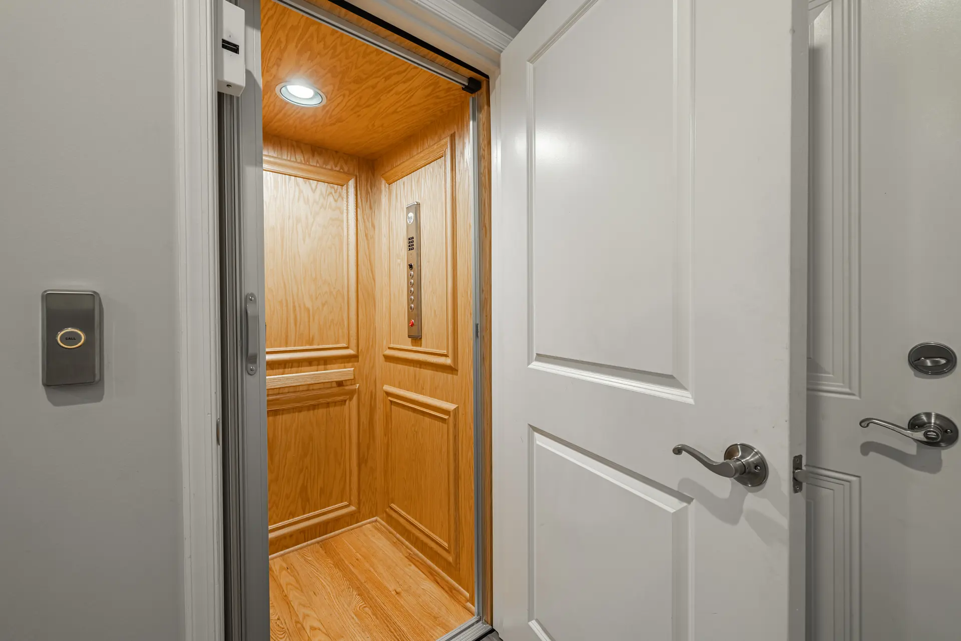 Private elevator with wood-paneled cab