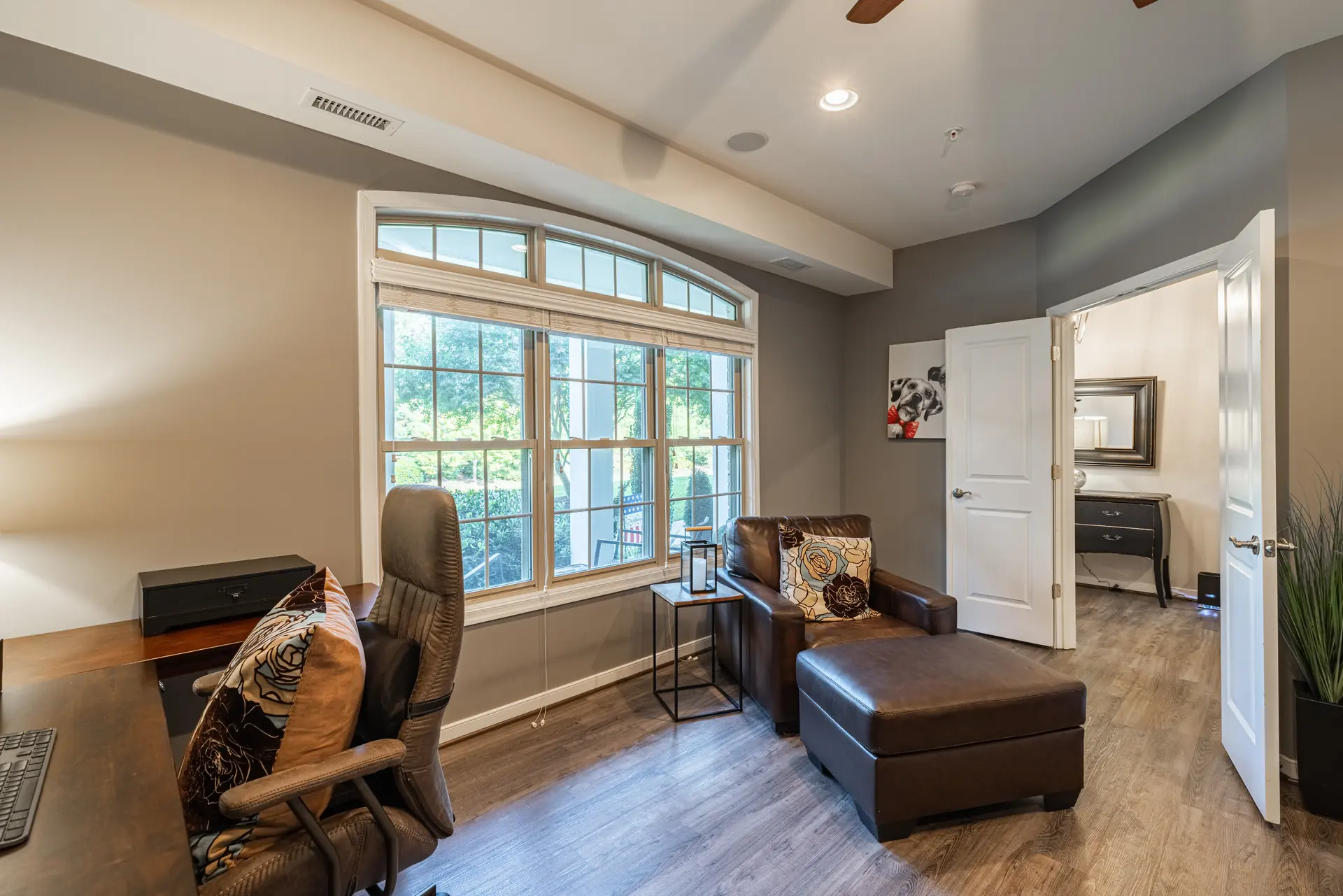 Home office with arched window