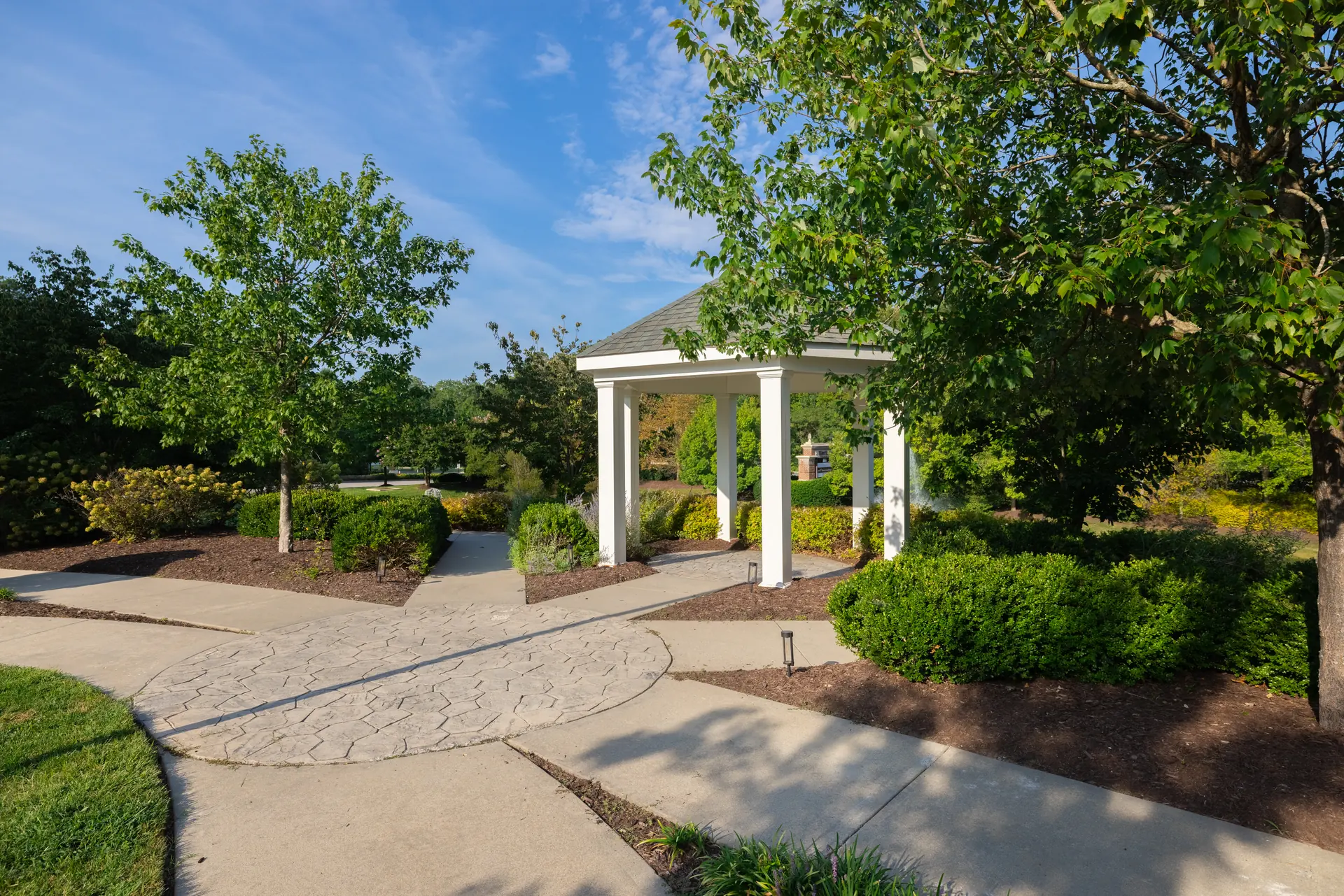 Garden gazebo along a landscaped walkway