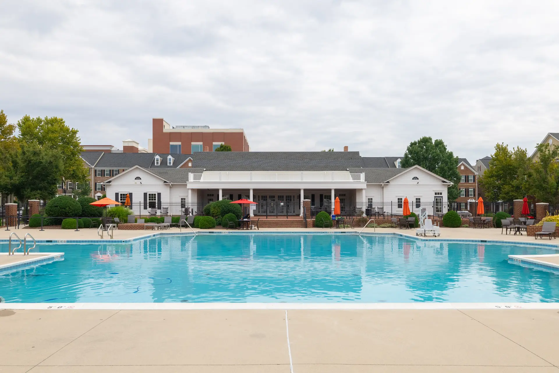 Community pool with the clubhouse beyond