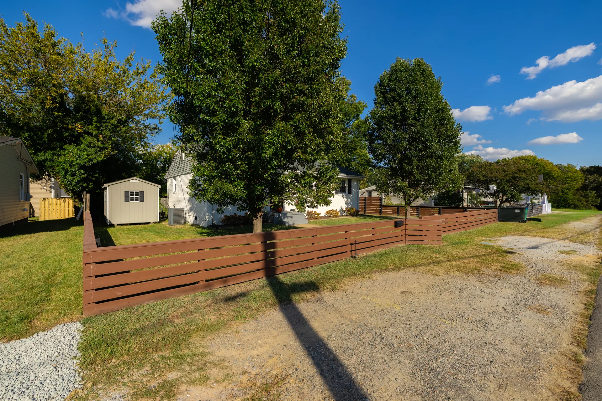 5312 Marian St &mdash; back garden with the storage shed and fenced boundary