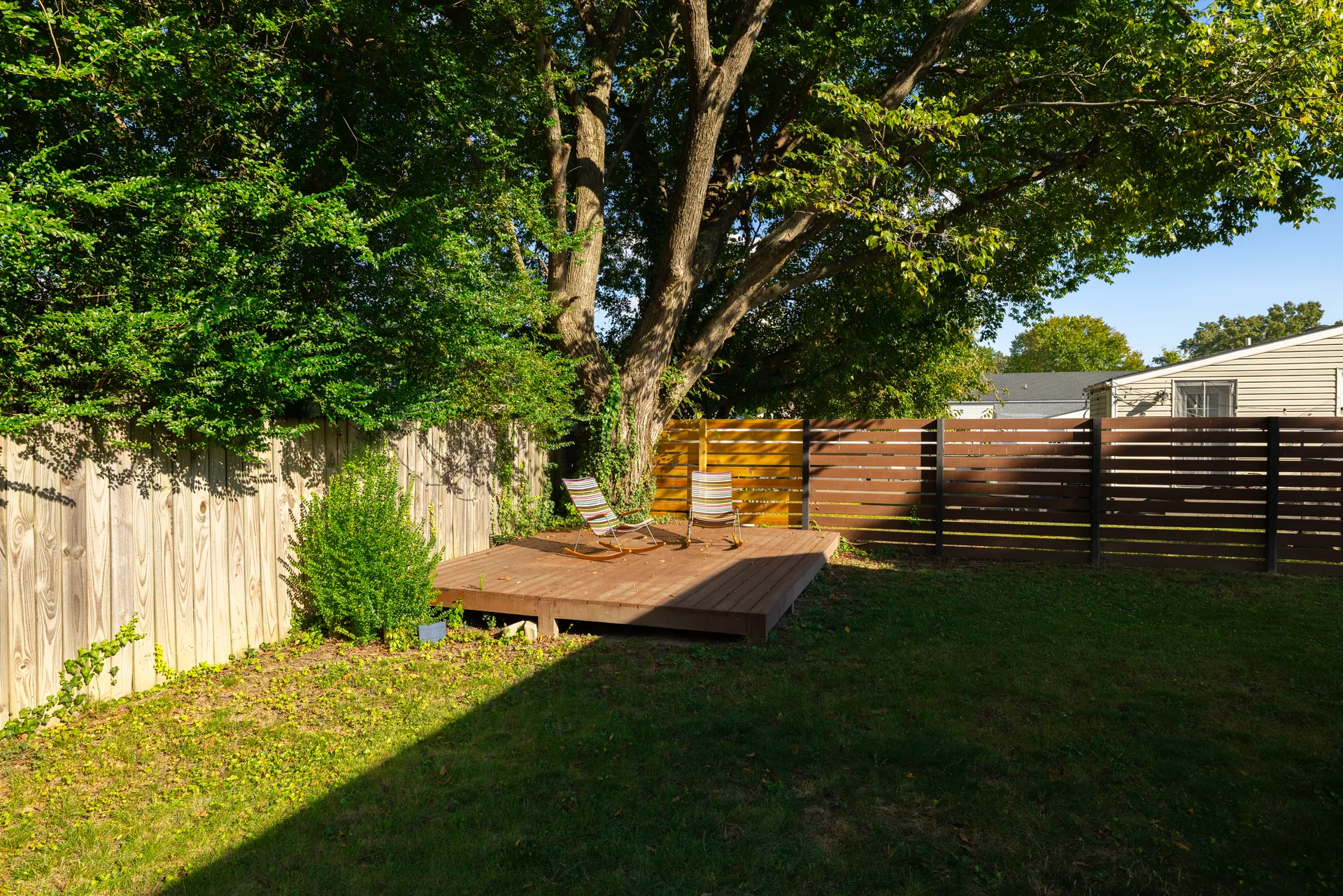 5312 Marian St &mdash; back garden with the deck platform and fencing