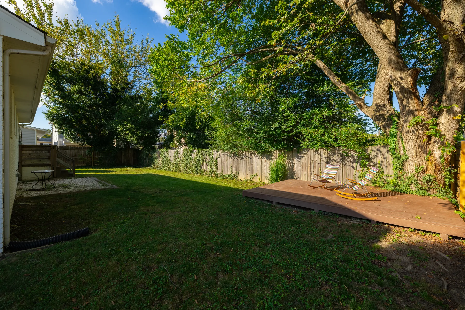 5312 Marian St &mdash; back garden under mature trees