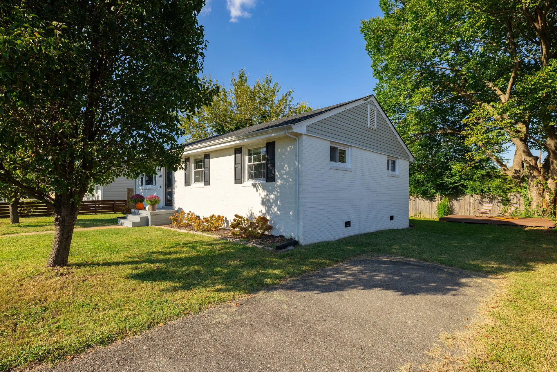 5312 Marian St &mdash; side garden and the driveway running past the house