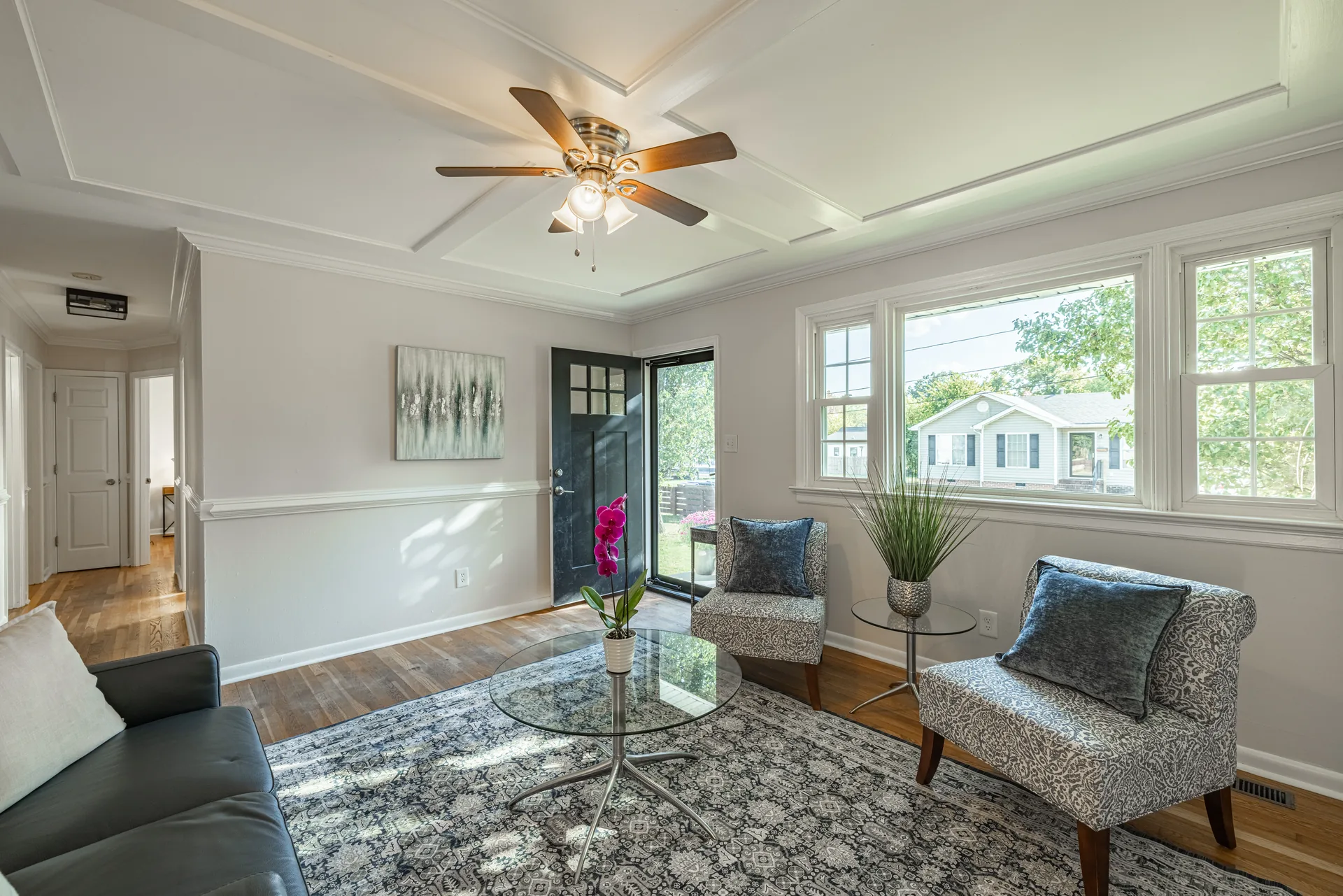 5312 Marian St &mdash; living room from the far corner, with the front door and front window