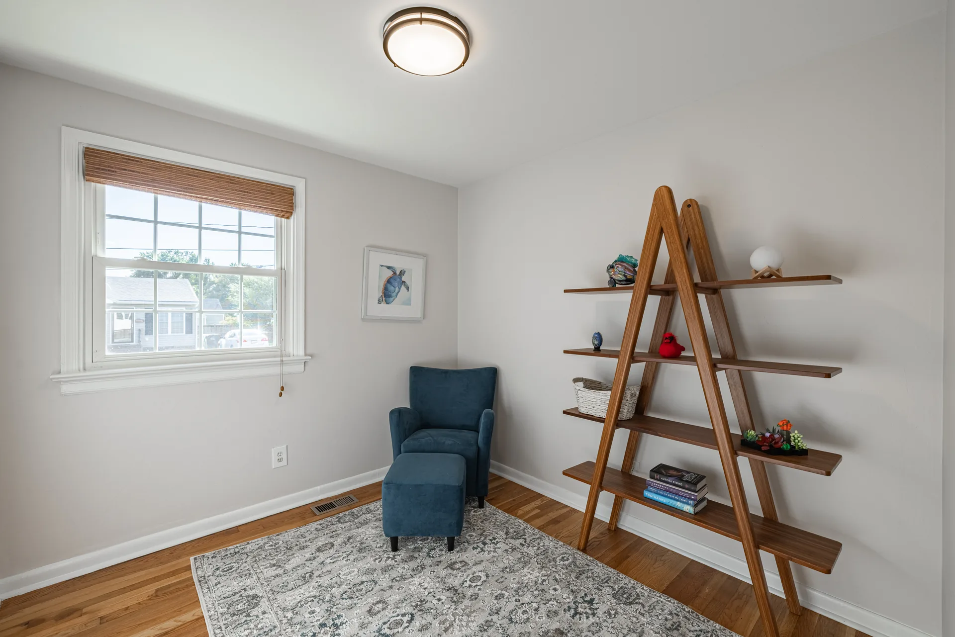 5312 Marian St &mdash; flexible room set up as a sitting area, with hardwood floors
