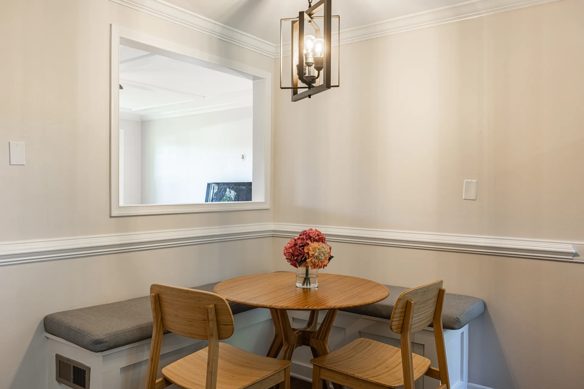 5312 Marian St &mdash; dining nook with a pendant light over a round table