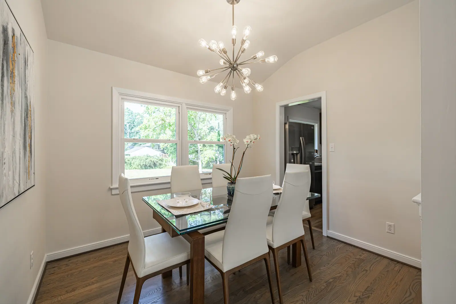 8006 Anoka Rd — dining room with modern chandelier