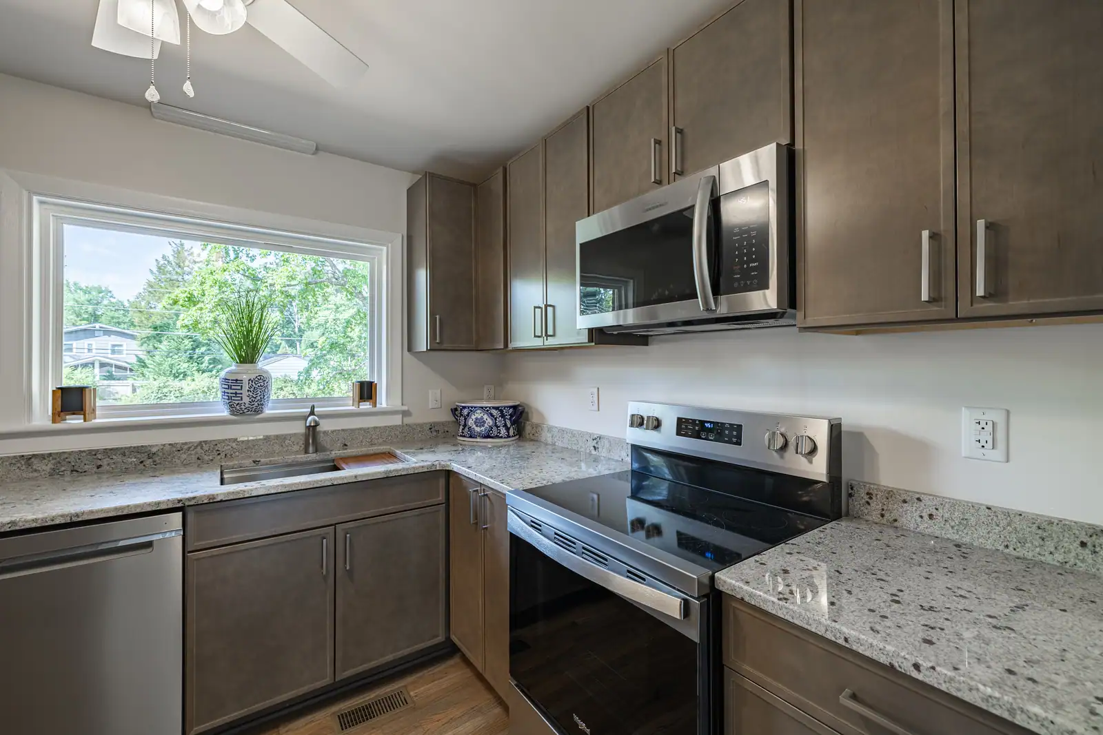 8006 Anoka Rd — kitchen with electric range and microwave