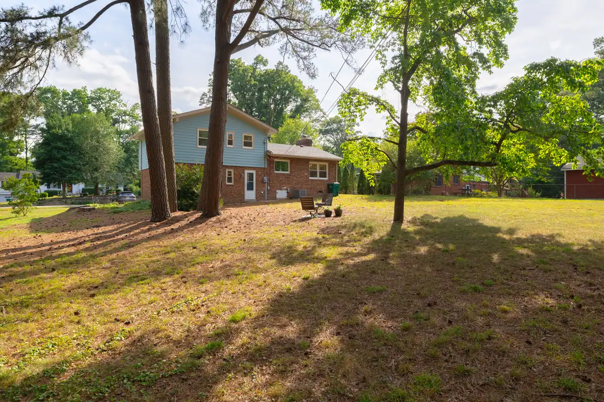 8006 Anoka Rd — backyard with mature trees