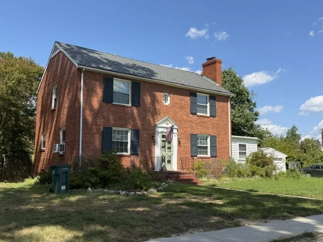 Two-story brick colonial with blue shutters in Lakeside, Henrico County