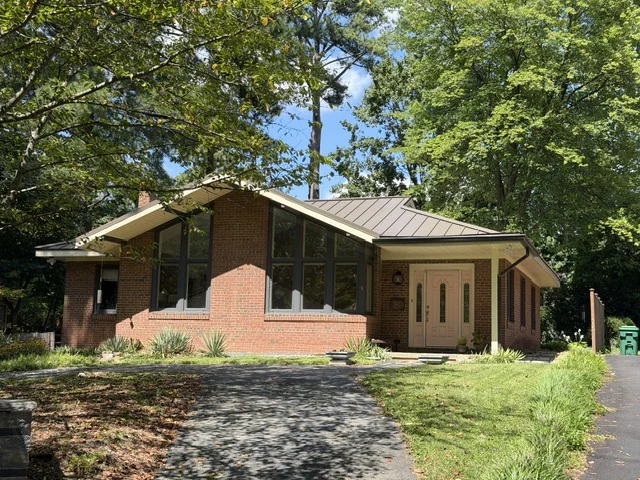 Midcentury brick ranch with a wide window wall in Lakeside, Henrico County